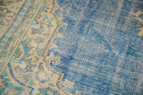 Worn blue field with abrash and exposed knot heads on a Vintage Distressed Oushak rug.