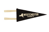 Westchester County black felt pennant with a cream graphic of New York State.