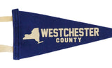 Royal blue felt pennant showing cream New York State graphic and 'WESTCHESTER'.