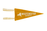 Golden yellow felt pennant with white Westchester County New York graphic, 4x9 inches.