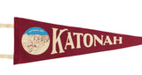 Circular Katonah Avenue town illustration on a crimson wool felt pennant.