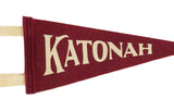 Cream serif lettering on the crimson wool felt of the Katonah NY mini pennant.