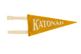 Old gold Katonah NY mini felt pennant with off-white lettering and hanging ties.