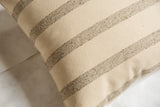 Textured remnant wool fabric with delicate beige and flecked stripe pattern.