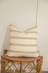Textured remnant wool fabric pillow with delicate speckled beige horizontal stripes.