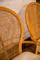 Close-up of natural rattan chair backs with varied woven patterns and subtle frame scratches.