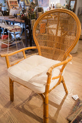 Bound rattan legs of a vintage chair on a light wood floor.