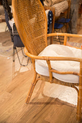 Rattan chair front leg showing natural texture and woven seat base.