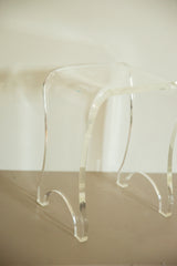Thick lucite legs with elegant curves on the vintage end table.