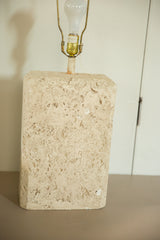 Vintage ceramic table lamp with a textured faux travertine block base and brass harp.