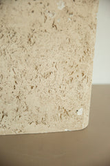 Close-up of the organic and porous texture of the faux travertine lamp.