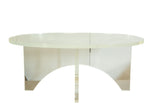 Vintage oval Lucite coffee table with a thick clear top and crisscross base.