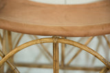Textured camel deerskin seat and natural rattan frame with a hand-tied joint.