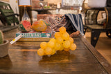 Translucent citrine stone spheres of vintage artificial grapes with natural stem.