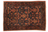 Hand knotted vintage Persian Bibikabad rug with geometric plants and florals in dusty raspberry, navy, wine.