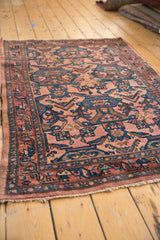 Low pile vintage Persian Bibikabad rug with short fringe and raspberry navy border.