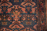 Vintage Bibikabad rug's secured side with dusty blush and navy geometric potted plants.