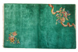 Hand-knotted Chinese Nichols Art Deco rug, emerald green with asymmetric floral designs, 3x4'11