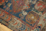 Visible foundation within worn navy, tangerine, and celadon geometric patterns.