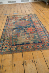 Heavily worn antique Caucasian rug, revealing foundation, holes, tatter, and geometric crab designs.