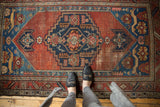Antique Malayer rug: dark blue medallion, madder red field, sapphire spandrels with deer. With feet.