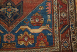 Antique Persian Malayer rug corner, sapphire blue spandrel with feline figures and florals.