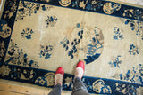 Vintage Peking rug, central partial medallion, expressive trees, bird motifs in ivory and blue.
