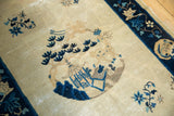 Vintage Peking rug's indigo blue pagoda motif and deer in roundel medallion.