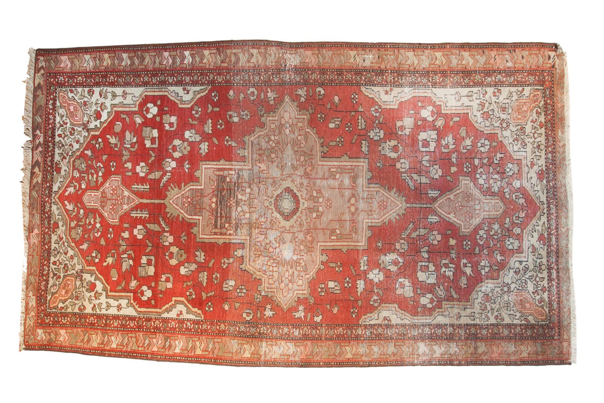Antique Farahan Sarouk rug with central medallion, delicate floral field, terra cotta, ivory, aged silver patina.