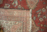 Antique Farahan Sarouk rug: hand-knotted foundation, fringed end, and secure side binding.