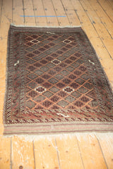 Patterned field, geometric border, and intact plain weave fringe of an antique Belouch rug.