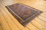 Intricate pawn design inner border and original goat hair selvage on an antique Belouch rug.