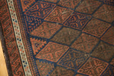 Antique Belouch rug with intricate pawn design border, original goat hair selvage, navy, and madder red.