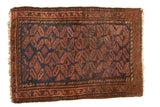 Vintage hand-knotted Belouch rug with repeating gul and pinwheel motifs, rich chestnut and navy, 2'5
