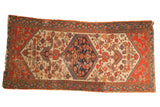 Antique Persian Malayer runner, oversized diamond medallion, Herati motifs, navy, ivory, orange, storied wear.