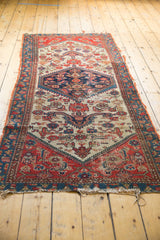 End of the Antique Malayer runner, displaying historic tatter and wear revealing its hand-knotted construction.