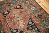 Antique Heriz rug medallion detail with stylized animals and rare celadon green border.