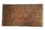 Vintage Distressed Lilihan rug featuring faded chestnut, sky blue, and ivory floral palmettes.