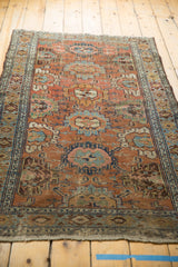 Distressed oversized floral palmettes in sky blue, gold, and chestnut brown, showing aged patina.