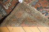 Hand-knotted back and distressed floral palmette pile of Lilihan rug.