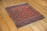 Tattered fringe and geometric border patterns on the lower edge of the antique Tekke rug.