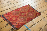 Corner of antique Turkish Yastik rug with geometric medallions in ruby red, saffron, sky blue and etching.