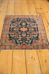 Vintage Mohajeran Sarouk rug mat corner with navy ground, brick red border, and sky blue floral vines.