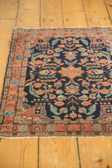 Vintage Persian Mohajeran Sarouk rug with central floral medallion, blooming vines on navy.