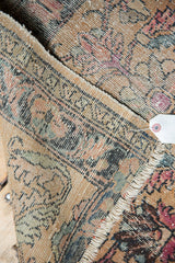 Antique Persian Lilihan rug mat showing hand-knotted texture, worn pile, and tattered fringe.