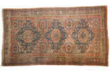 Antique Caucasian Soumac carpet showcasing triple navy and blush medallions, allover dusty brick red field, 7' x 12'3