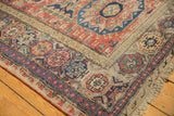 Antique Soumac carpet, intricate geometric and floral patterns in red, blue, ivory.