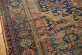 Intricate red, blue, teal border and exposed foundation of antique Soumac carpet.