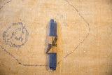 Cobalt blue beeswax taper candles, Greentree Home ribbon-wrapped, on a textured rug.
