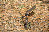 Everyday sage green 6 inch beeswax taper candles wrapped with Greentree Home ribbon.